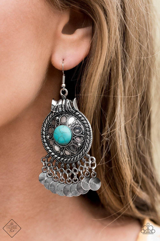 Paparazzi Accessories - Rural Rhythm - Blue Earrings a polished turquoise stone is pressed into the center of a silver frame stamped in seasonal floral patterns. Textured silver discs dangle from the bottom of the frame, creating a whimsical fringe. Earring attaches to a standard fishhook fitting.  Sold as one pair of earrings.