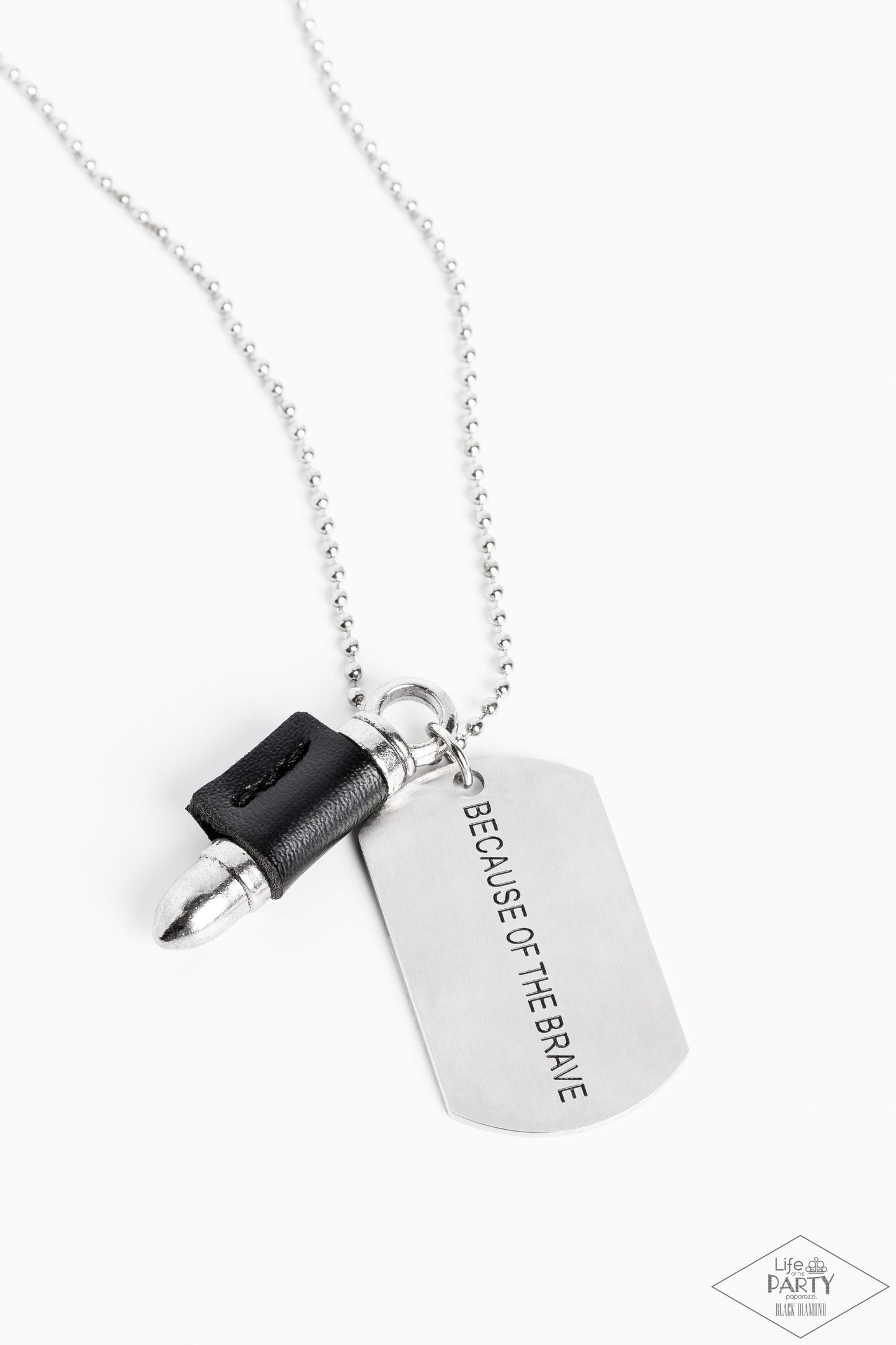 Paparazzi Accessories - Proud Patriot - Black Urban Necklace pinched between a black leather fitting, a silver bullet pendant joins a silver dog tag at the bottom of a silver ball chain. The shimmery dog tag is stamped in the phrase, "Because of the Brave," for a patriotic finish. Features a ball and clasp closure. Sold as one individual necklace.