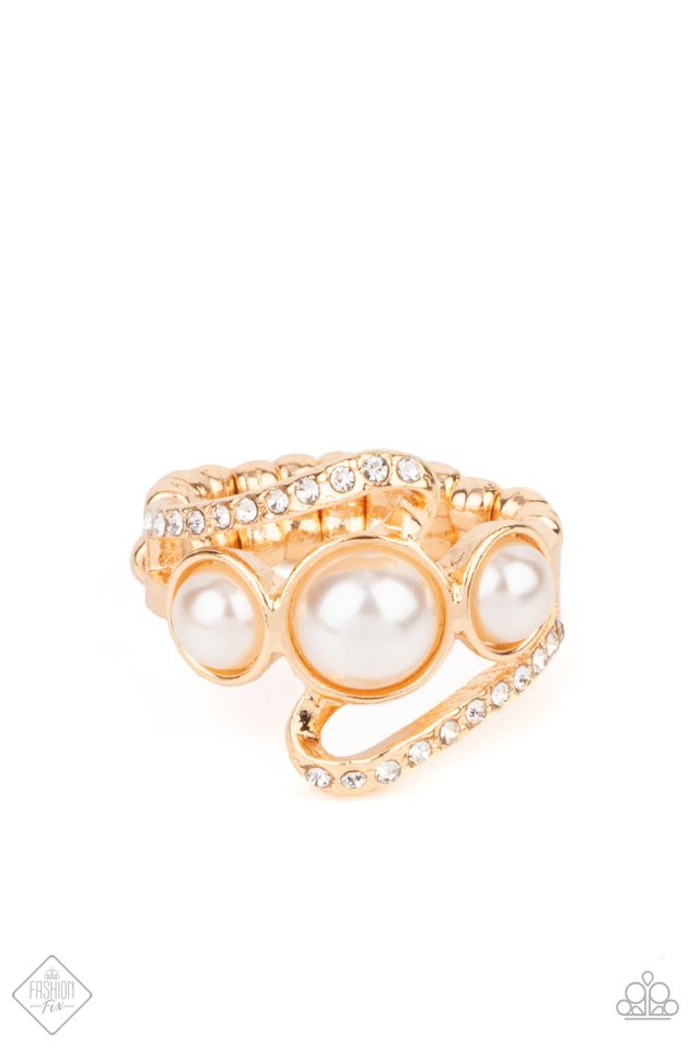 A golden ribbon of white rhinestones whirls around and behind a single band of three bubbly white pearls, coalescing into a timeless twinkle atop the finger. Features a dainty stretchy band for a flexible fit.  Fiercely 5th Avenue August 2021
