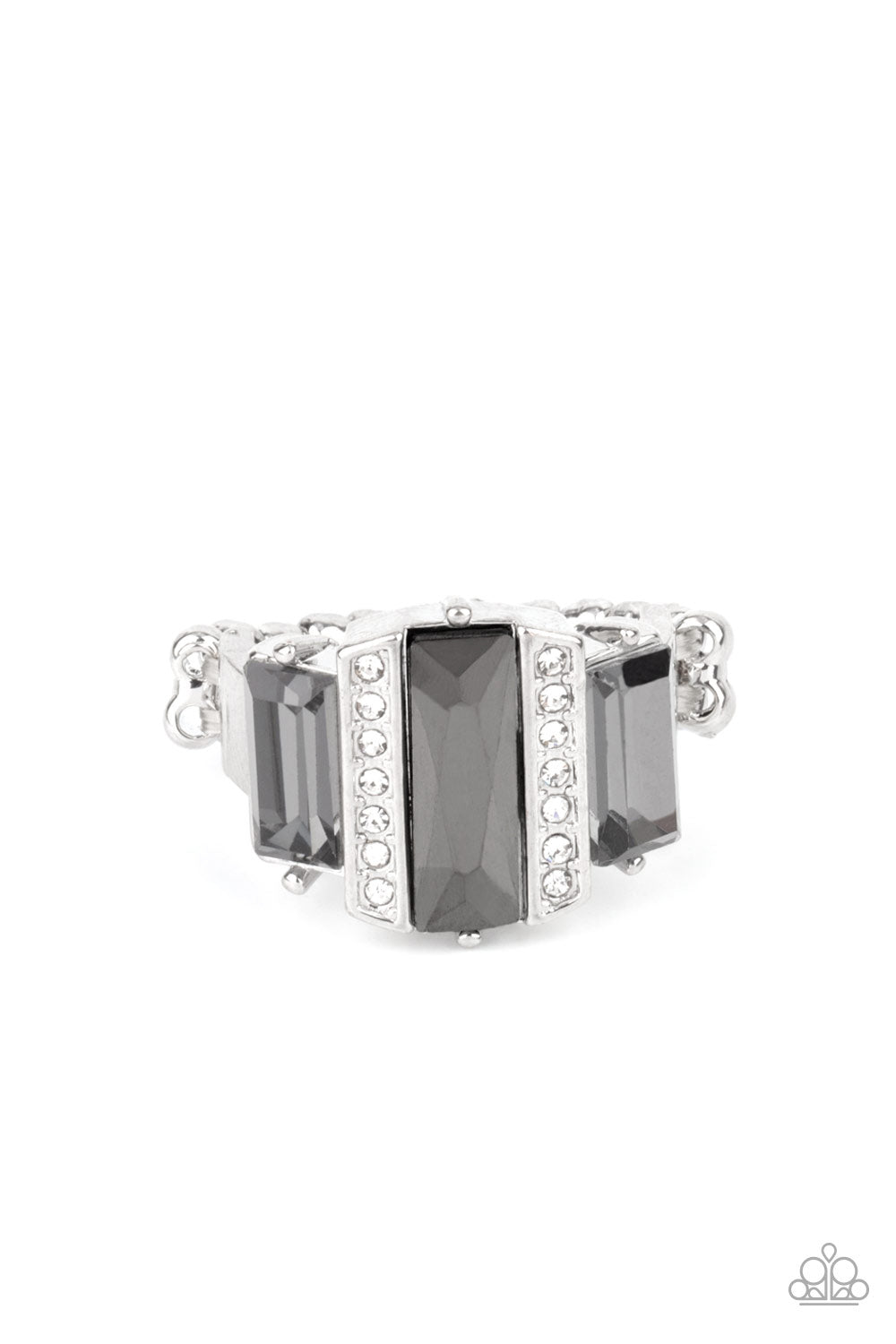 Paparazzi Accessories - A Glitzy Verdict - Silver Ring bordered by two rows of dainty white rhinestones, an emerald cut hematite rhinestone adorns the center of a band dotted with a pair of smoky emerald cut rhinestones, resulting into a jaw-dropping dazzle across the finger. Features a stretchy band for a flexible fit.  Sold as one individual ring.