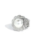 <p data-mce-fragment="1">Paparazzi Accessories - Storybook Ending - White Rings a whirl of white rhinestone encrusted silver petals blooms from a dramatically oversized white pearl drop center, culminating in an elegant floral centerpiece atop the finger. Features a stretchy band for a flexible fit.</p> <p data-mce-fragment="1"><i data-mce-fragment="1">Sold as one individual ring.</i></p>