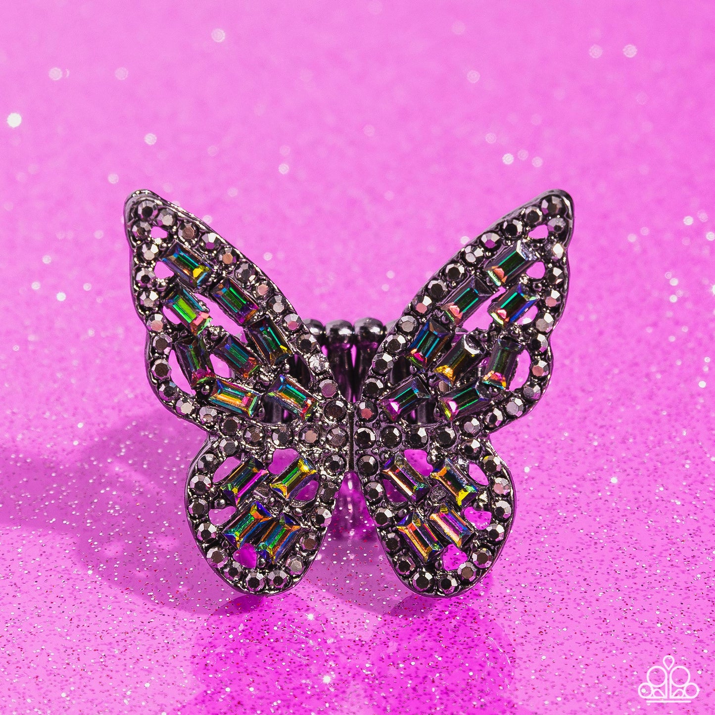 Paparazzi Accessories - Flauntable Flutter - Multi Rings dainty oil spill emerald-cut rhinestones are sprinkled across the gunmetal wings of a butterfly that is encrusted in dauntless hematite rhinestones for a dramatically dazzling finish. Features a stretchy band for a flexible fit. Sold as one individual ring.