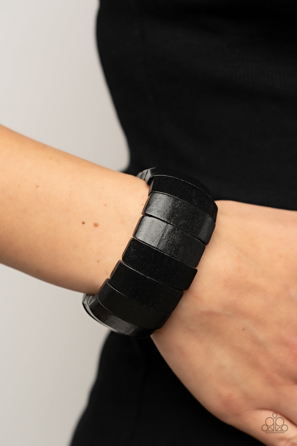 Paparazzi Accessories - Island Grind - Black Wood Bracelet a Polished black wooden frames are threaded along stretchy bands around the wrist, resulting in a tropical inspired centerpiece. Sold as one individual bracelet.