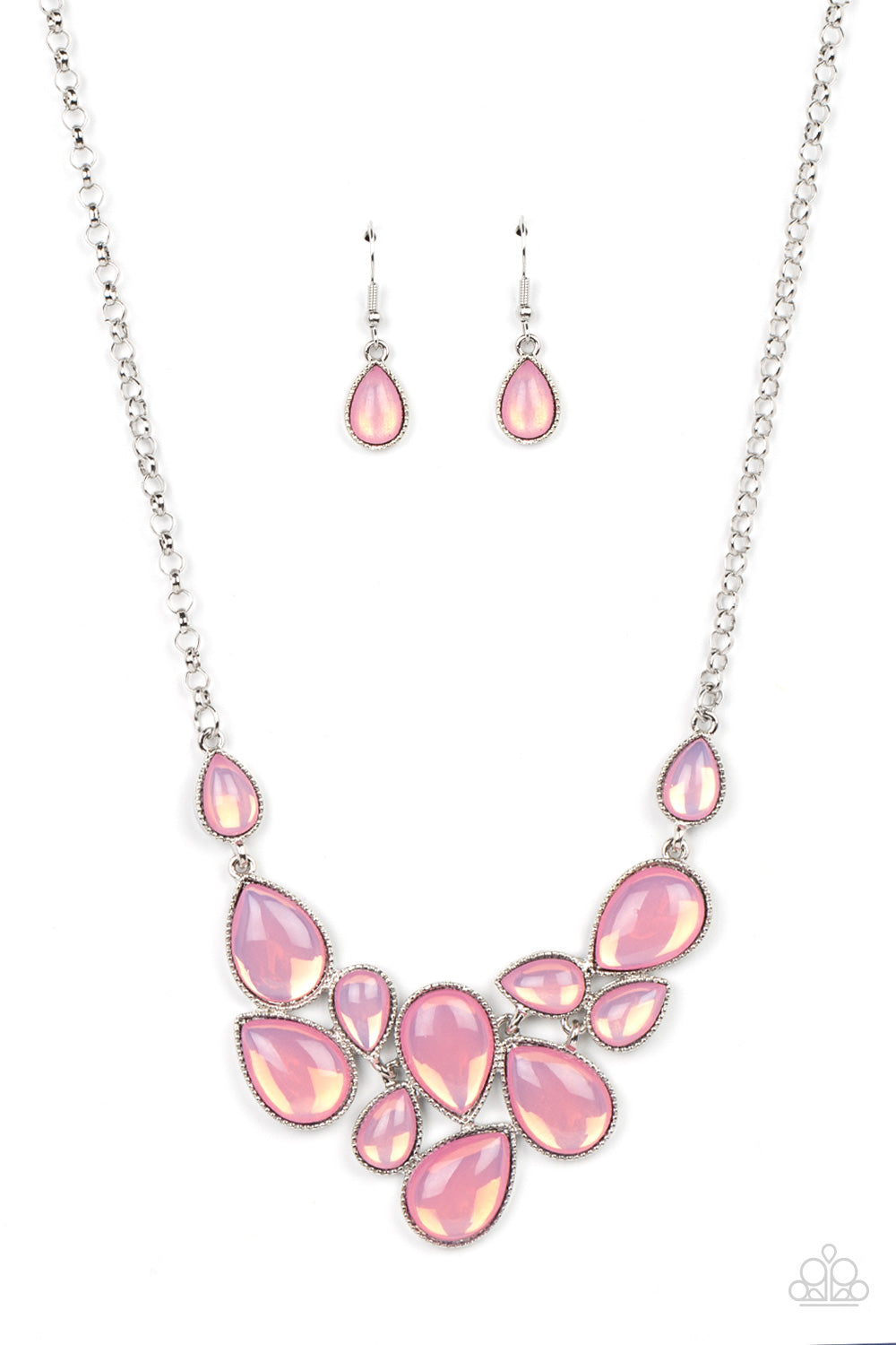 Paparazzi Accessories - Keeps GLOWING and GLOWING - Pink Necklaces a cascade of glassy opalescent pink teardrops are encased in studded silver frames, ultimately clustering below the collar to create an enchanting pop of color. Features an adjustable clasp closure.  Sold as one individual necklace. Includes one pair of matching earrings.