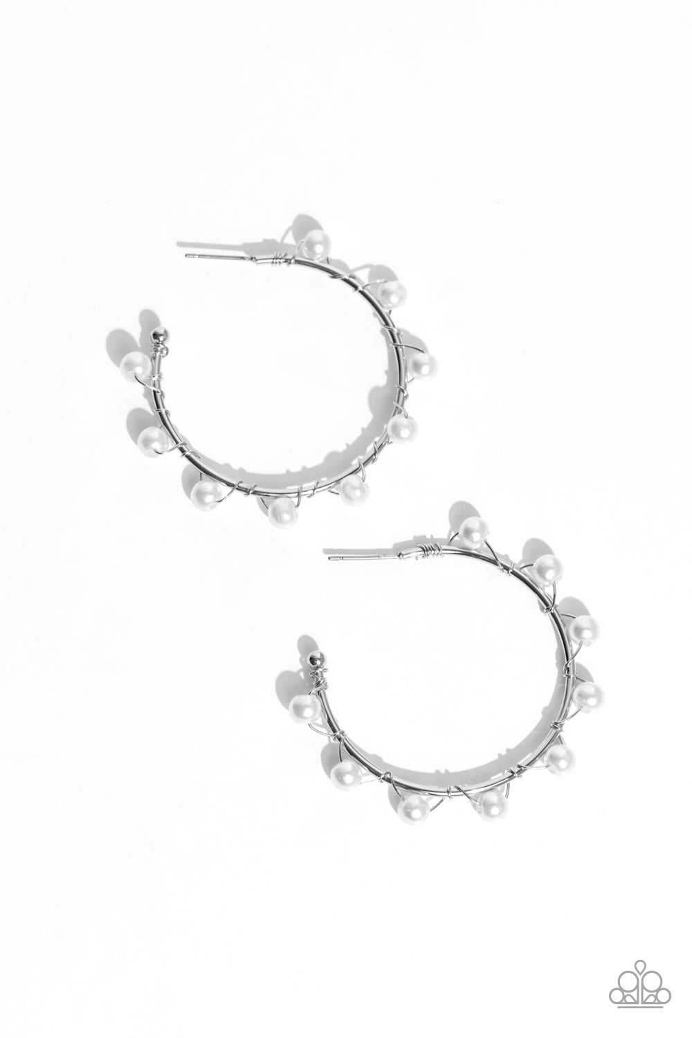 Paparazzi Accessories - Night at The Gala - White Pearl Earrings a classy collection of dainty white pearls are wrapped along the outside curve of a shiny, silver hoop by shimmery silver wire for a handcrafted, posh finish. Earring attaches to a standard post fitting. Hoop measures approximately 1 1/4" in diameter. Sold as one pair of hoop earrings.