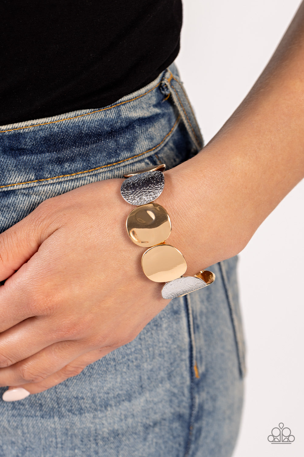 Paparazzi Accessories - Rippling Record - Multi Bracelets a hammered collection of asymmetrical silver and gold discs are threaded along stretchy bands around the wrist for a refined flair. The silver discs feature a rippling hammered effect, while the gold discs feature a more subtle hammered effect, creating a fashionable contrast amidst the different colors. Sold as one individual bracelet.