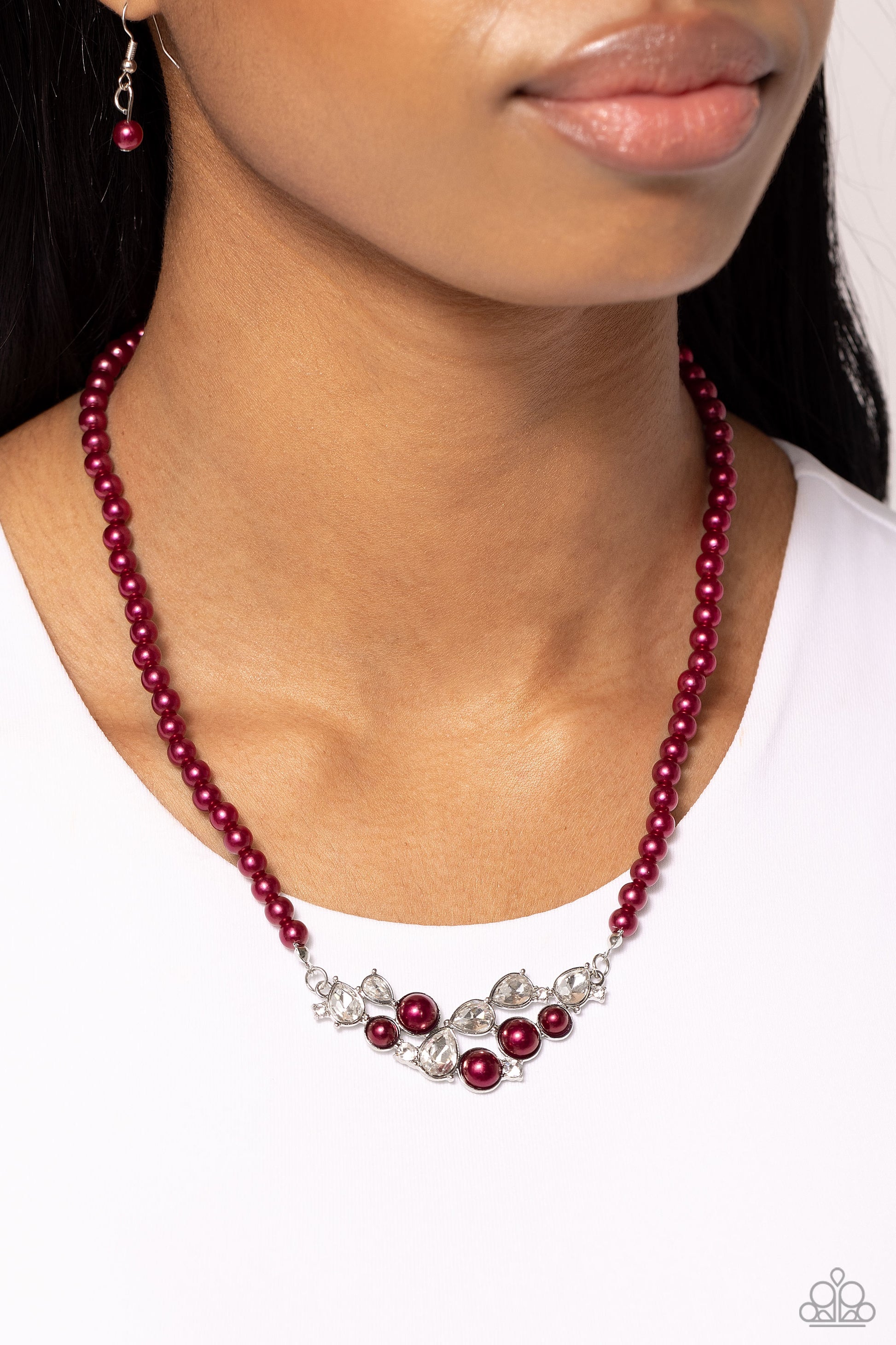 Paparazzi Accessories - Pampered Pearls Red Necklaces a single strand of wine pearls elegantly cascades below the collar to meet a refined collection of wine pearls in varying sizes and white gems pressed in round and teardrop frames for a sparkly finish. Features an adjustable clasp closure.  Sold as one individual necklace. Includes one pair of matching earrings.