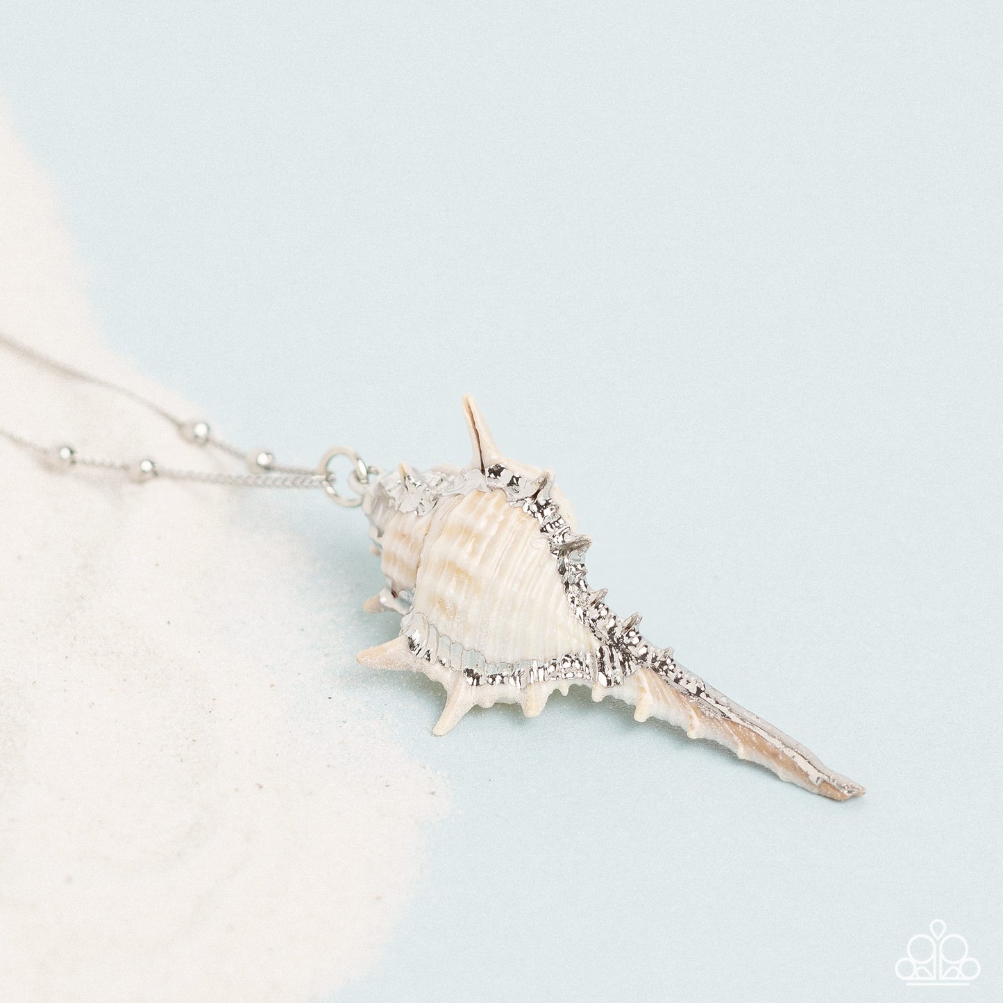 Paparazzi Accessories - Sea CONCH - White Necklaces cascading down the chest from an elongated silver chain sporadically infused with silver studs, a conch shell lined with glittering silver creates a stunning seaside statement. Features an adjustable clasp closure. Sold as one individual necklace. Includes one pair of matching earrings.
