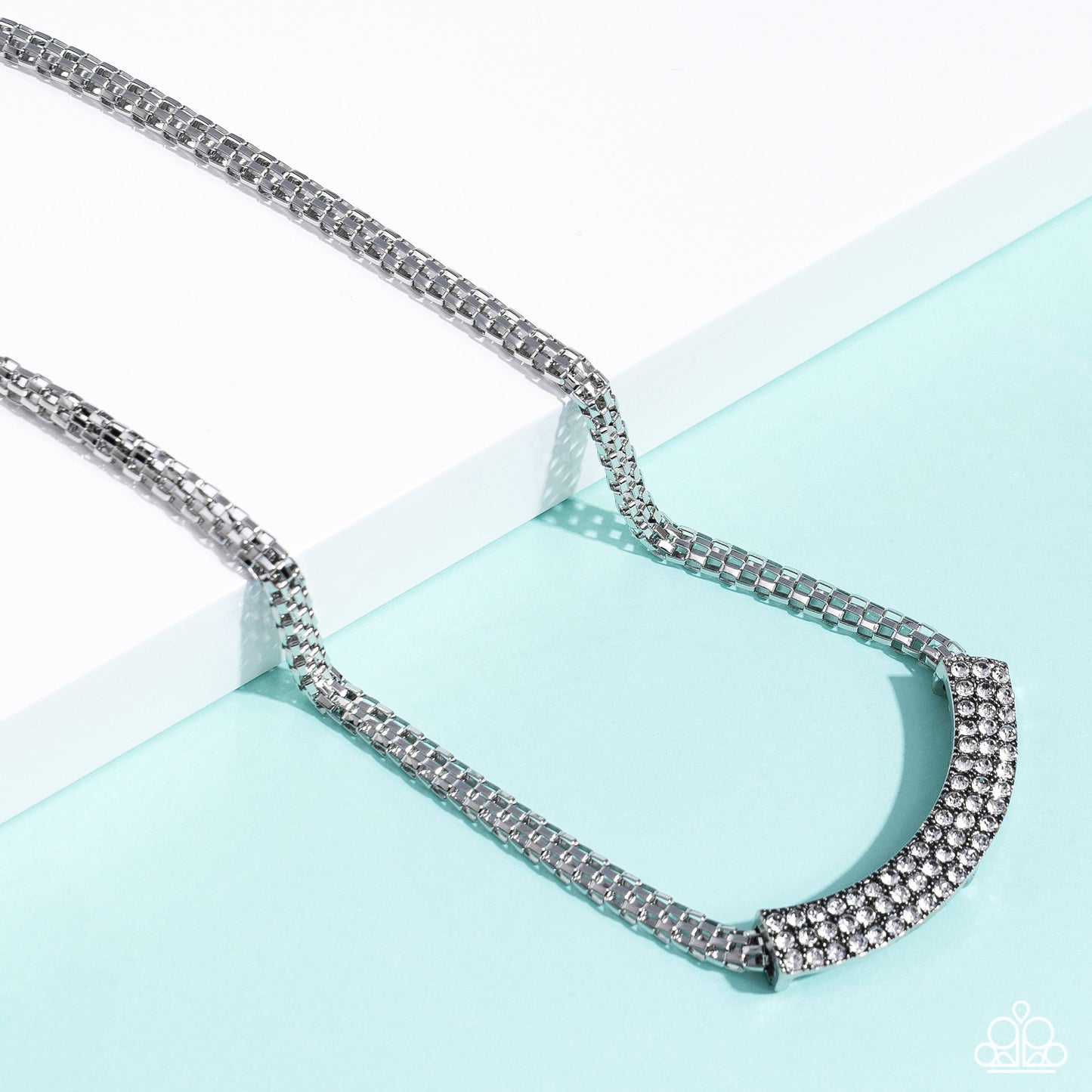 Paparazzi Accessories - Swing Dance Dream - Silver Necklaces featuring a high-sheen finish, a curved silver pendant slides along a rounded silver mesh chain below the collar. Three rows of dainty white rhinestones encrusted along the silver frame, add hints of shimmer to the bold industrial palette. Features an adjustable clasp closure. Sold as one individual necklace. Includes one pair of matching earrings.