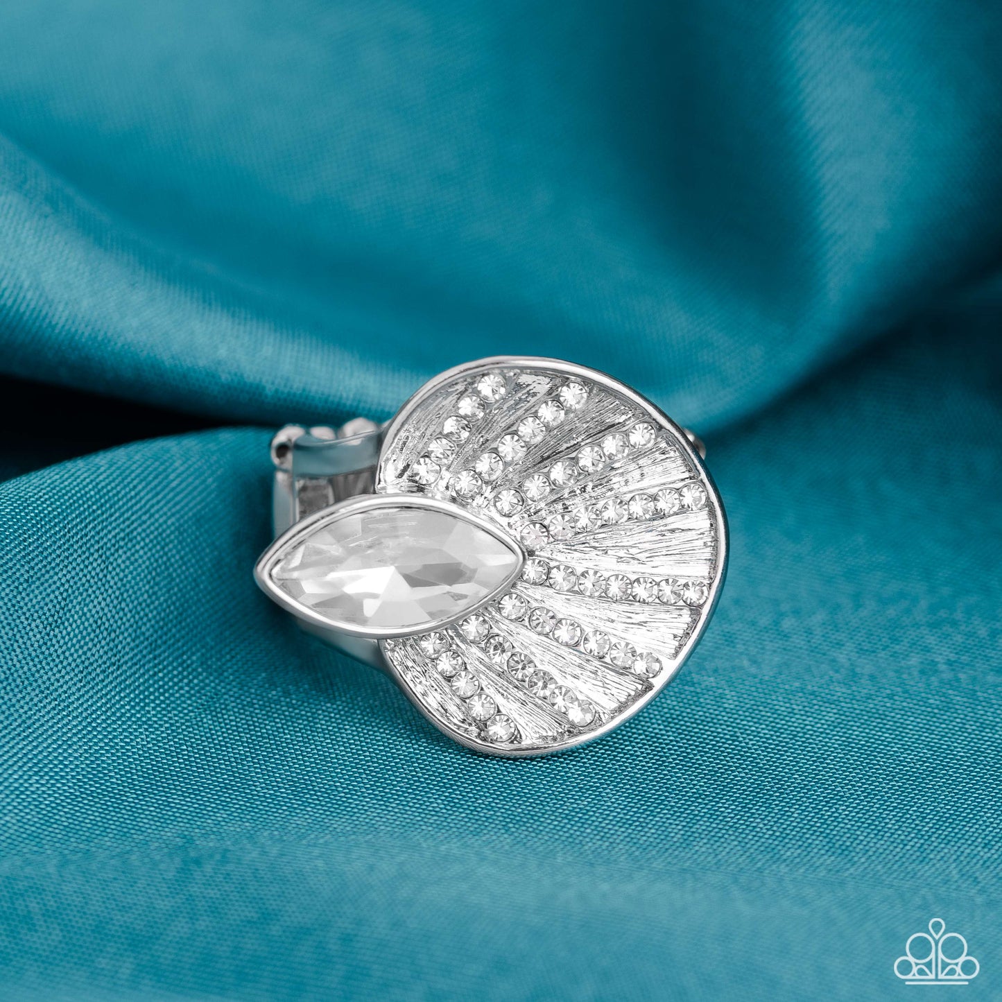 Paparazzi Accessories - Fan Dance Dazzle - White Ring an asymmetrical silver disc, featuring linear layers of dainty white rhinestones against a textured backdrop, reflect light off its every angle from airy silver bands. A marquise-cut white gem interrupts the fan-like pendant, creating additional shine to the glitzy display. Features a stretchy band for a flexible fit. Sold as one individual ring.