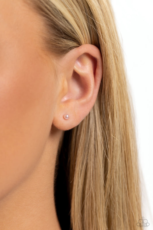 Paparazzi Accessories - Dainty Details - Pink Pearl Stud Earrings a dainty baby pink pearl rests against the ear for a timeless basic staple piece perfect for a vintage look. Earring attaches to a standard post fitting.  Sold as one pair of post earrings.