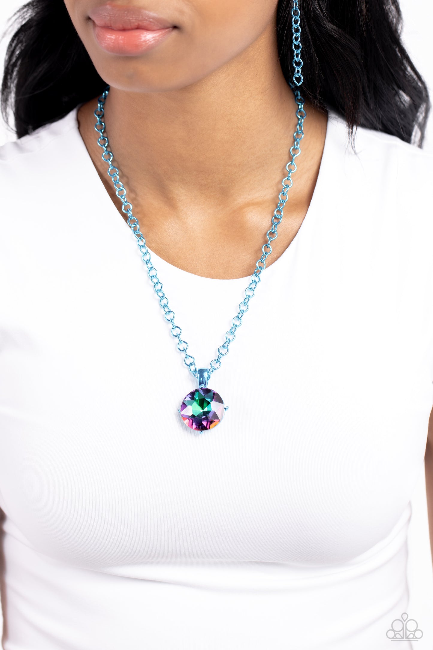 Paparazzi Accessories - Las Vegas DIP - Blue Necklaces featuring a classic elongated chain in a vibrant blue hue, an oversized UV pendant in blue pronged fittings shimmers down the chest for a charismatic finish. Features an adjustable clasp closure. Sold as one individual necklace. Includes one pair of matching earrings.