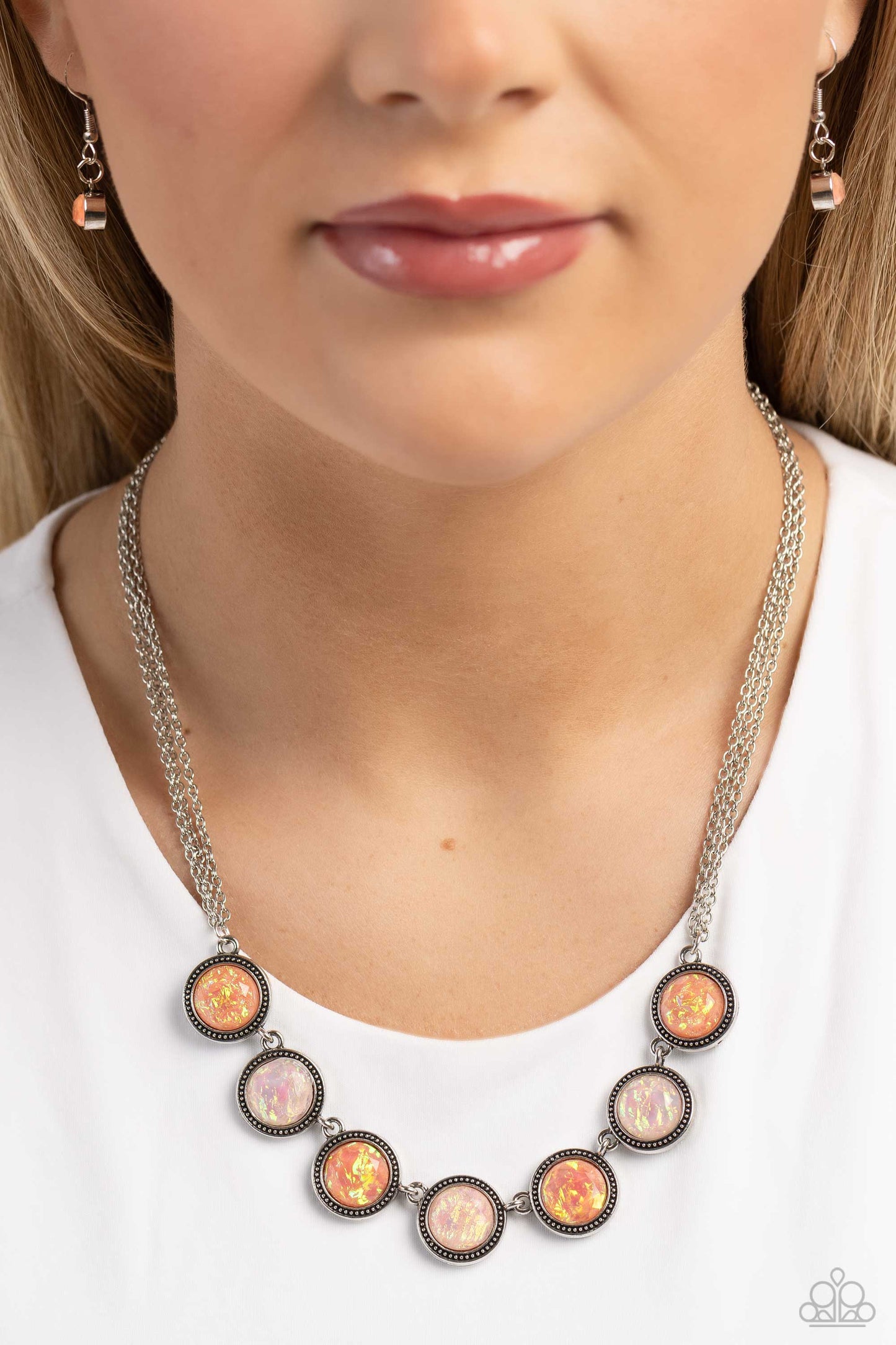 Paparazzi Accessories - Looking for DOUBLE - Orange Necklaces suspended between dainty layers of silver chain, a collection of glassy peach and orange gems featuring a refracted shimmer and an opalescent finish link along the collar to create a hypnotic pop of color. Due to its prismatic palette, color may vary. Sold as one individual necklace. Includes one pair of matching earrings.