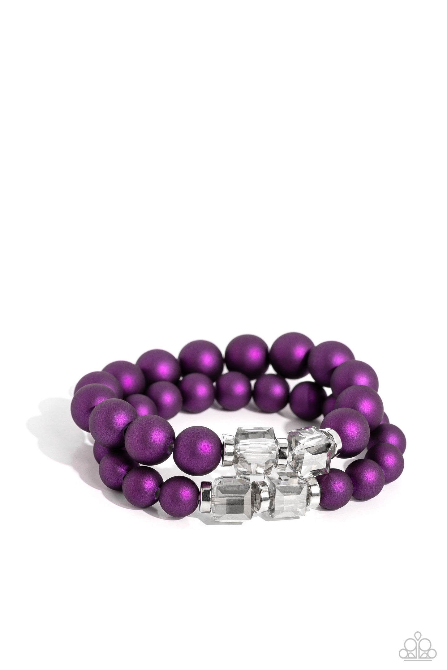 two rows of oversized purple beads featuring a subtle shimmer, silver accents, and clear gray cubed beads fall below the collar on silver paperclip chains, creating refined, colorful layers. Features an adjustable clasp closure. Sold as one individual necklace. Includes one pair of matching earrings. Two strands of oversized purple beads featuring a subtle shimmer, silver accents, and clear gray cubed beads stretch around the wrist, creating refined, colorful layers.
