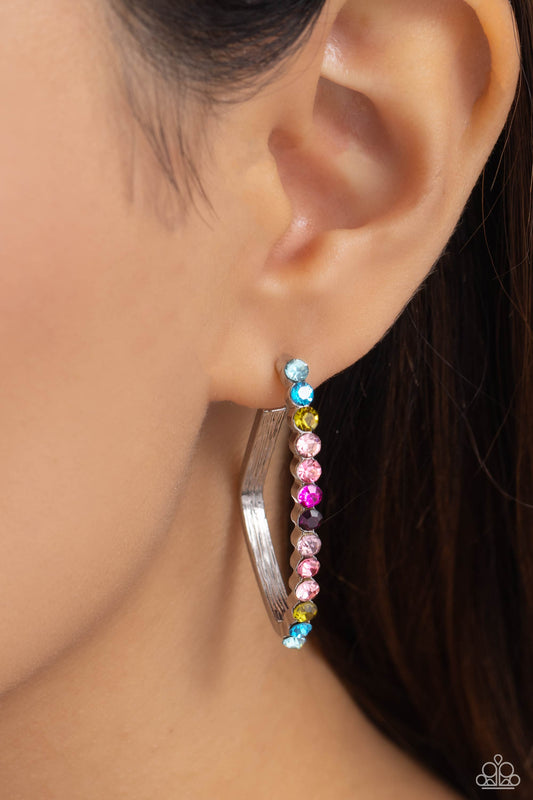 Paparazzi Accessories - Triangular Tapestry - Multi Hoop Earrings the front of a bold silver hoop is encrusted in multicolored rhinestones, creating a sparkly spectrum of color. The multicolored scalloped frame leisurely bends into an airy triangular frame for a geometric motif. Earring attaches to a standard post fitting. Hoop measures approximately 1/2" in diameter.  Sold as one pair of hoop earrings.