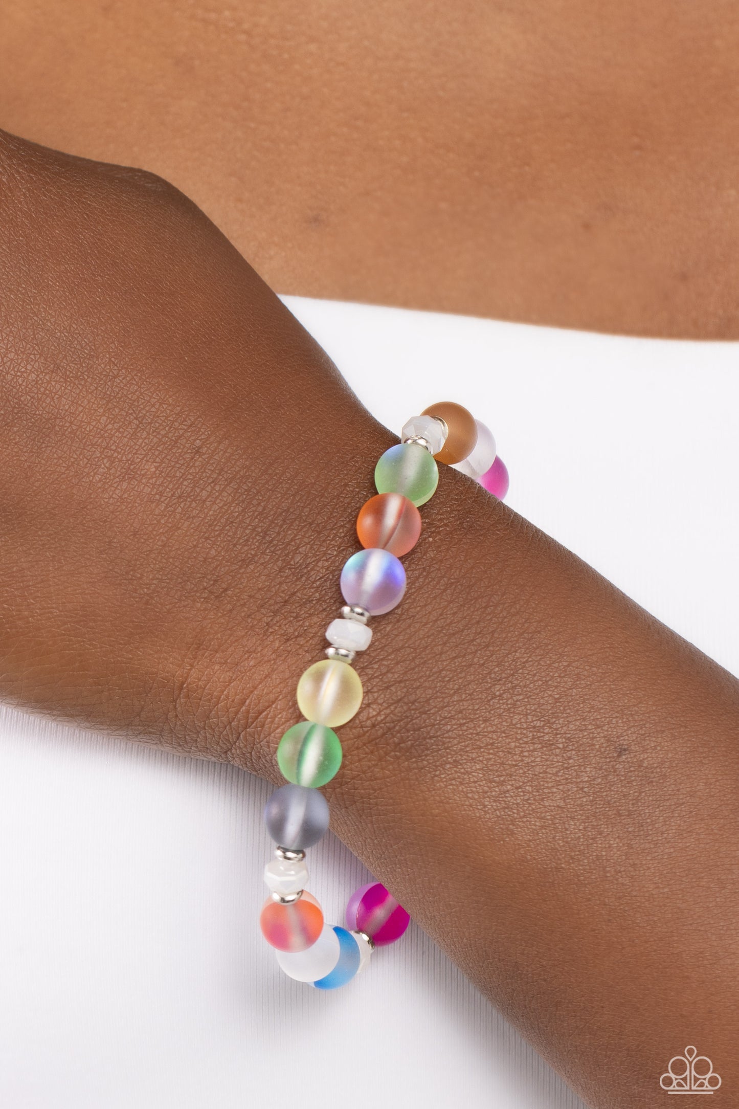 Paparazzi Accessories - Mermaid Mirage - Multi Bracelets infused with silver accents and faceted white beads, a dreamy collection of frosted glassy multicolored beads is threaded along a stretchy band around the wrist for an enchanting glow. Sold as one individual bracelet. Order date 10/1/23