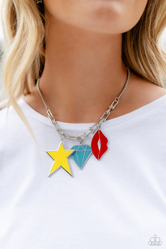 Paparazzi Accessories - Scouting Shapes - Multi Necklace a strand of gleaming silver popcorn chain leads the eye down to a collection of silver horseshoe-like strands that coalesce below the collar. Attached to the horseshoe fittings, an oversized yellow star, turquoise diamond, and red lip charm add a youthful pop of color to the design for a trendy finish. Features an adjustable clasp closure.  Sold as one individual necklace. Includes one pair of matching earrings.