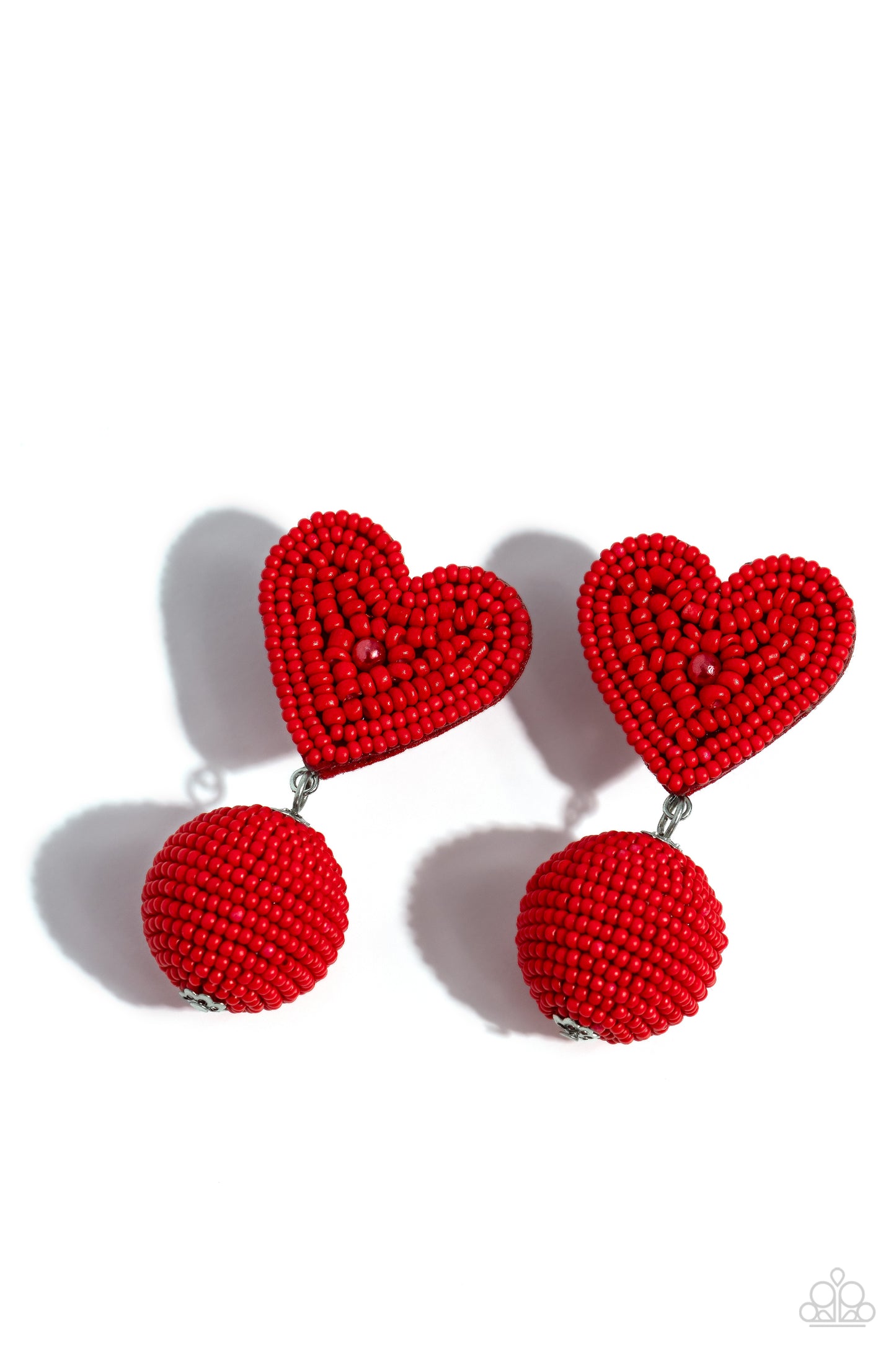 Paparazzi Accessories - Spherical Sweethearts - Red Earrings featuring a red pearl center, a red seed bead heart frame gives way to strands of red seed beads that decoratively spin around a spherical frame, resulting in a colorful three-dimensional display. Earring attaches to a standard post fitting. Sold as one pair of post earrings.