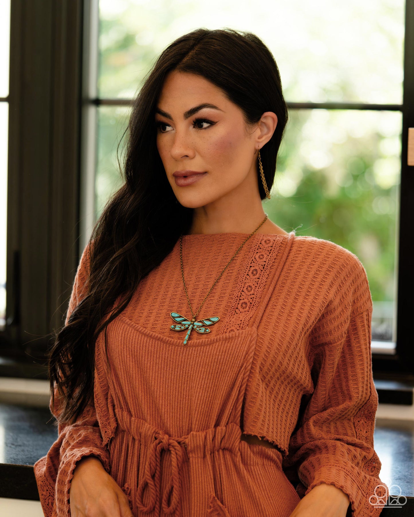 Paparazzi Accessories - Flying Low - Brass Necklaces featuring a classic brass chain, various cuts of turquoise stone are passed into an oversized, airy brass dragonfly pendant for a rustically earthy centerpiece. Features an adjustable clasp closure. As the stone elements in this piece are natural, some color variation is normal. Sold as one individual necklace. Includes one pair of matching earrings.