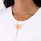 Paparazzi Accessories - Suspended Shades - Rose Gold Necklaces anchored along a looped sleek rose gold chain, a Peach Pink, Tender Peach, and white spotted butterfly flutters for a whimsical, standout centerpiece. Features a bolo closure.  Sold as one individual necklace. Includes one pair of matching earrings.