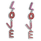 Paparazzi Accessories - Admirable Assortment - Pink Earrings Silver letters with various Valentine's-inspired details spell out the word "LOVE" as they vertically cascade down the ear in a flattering finish. The "L" features hot pink-painted hearts, the "O" features a red background with white rhinestones and dainty white pearls, the "V" features a baby pink glitter backdrop, and the "E" features stripes of white and red. Each of the letters are interconnected to one another, infusing the design.