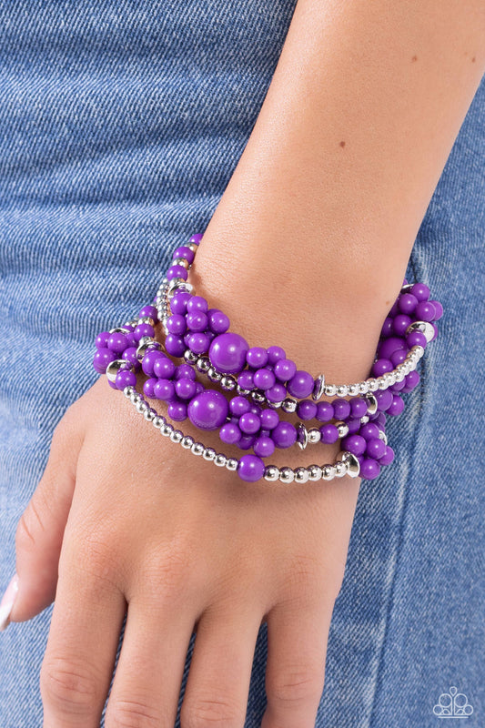 Paparazzi Accessories - Compelling Clouds - Purple Bracelets strands of sleek silver beads and accents mixed with plum acrylic beads in varying sizes are threaded along an infinity wrap-style bracelet. Clusters of beads are sporadically infused along the design, creating cloud-like, ethereal layers around the wrist.  Sold as one individual bracelet.