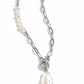 Paparazzi Accessories - Courting Cosmopolitan - White Necklaces an elegant lariat closure, an oversized, baroque white pearl cascades from the bottom of a silver paperclip chain for a refined fashion. Dainty, glossy baroque pearl beads are infused along one side of the silver chain.  Sold as one individual necklace. Includes one pair of matching earrings.