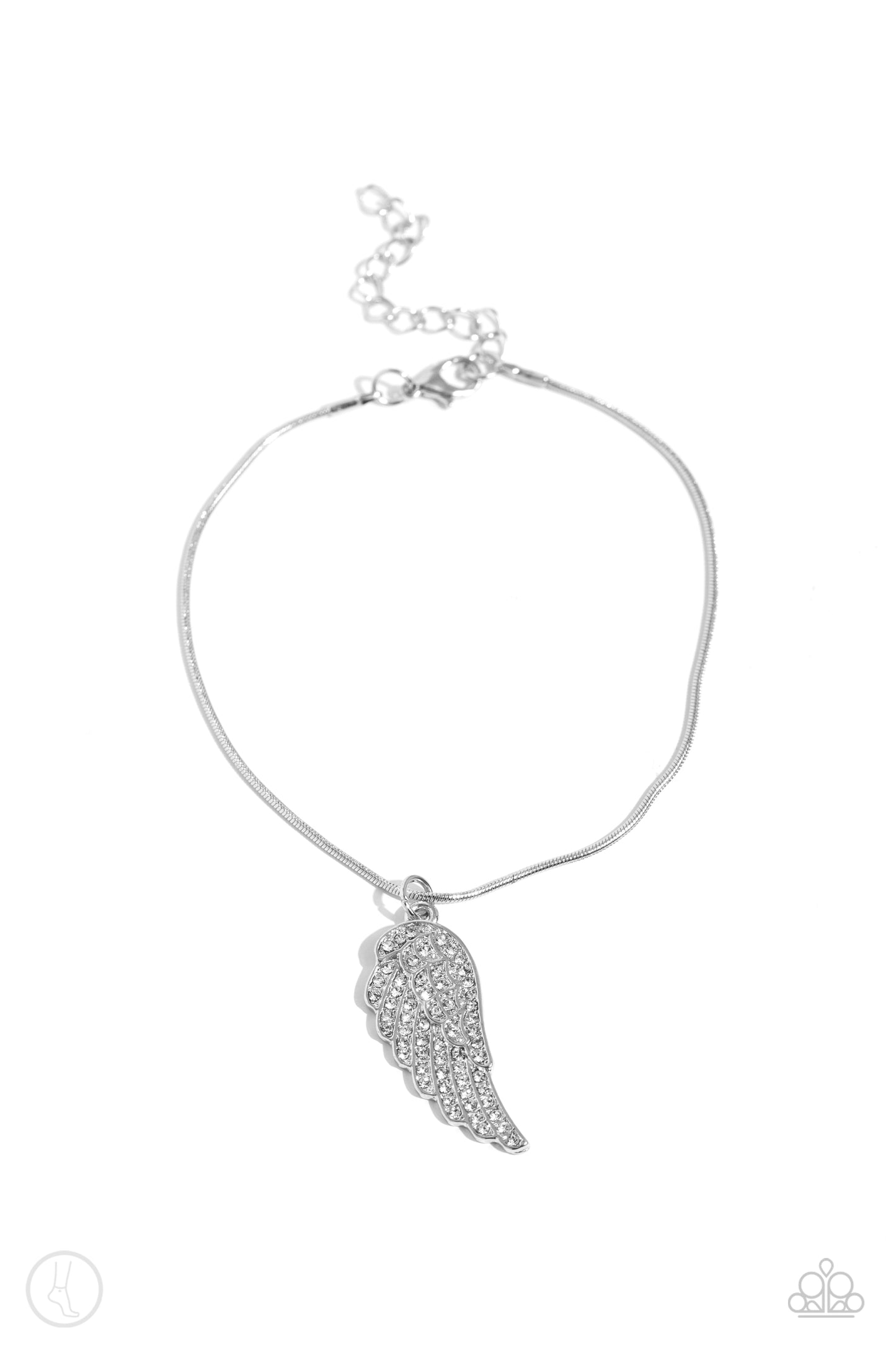 Paparazzi Accessories - Angelic Accent - White Anklet an angelic silver half-wing pendant delicately wraps around the ankle on a silver snake chain. Rows of dainty white rhinestones adorn the winged accents, adding a celestial shimmer to the angelic centerpiece. Features an adjustable clasp closure. Sold as one individual anklet.
