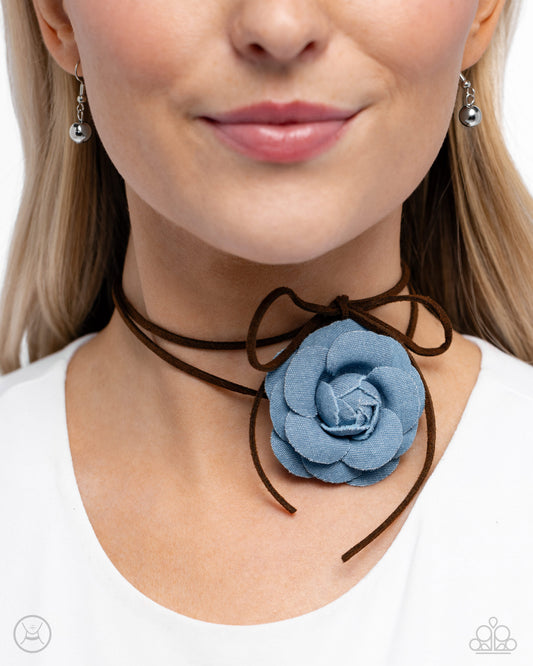 Paparazzi Accessories - Floral Folktale - Brown Choker Necklaces Featuring tactile detail, a three-dimensional, oversized denim rose slides along strips of brown suede, creating a Western floral-inspired centerpiece around the collar. Features an adjustable claspSold as one individual choker necklace. Includes one pair of matching earrings.