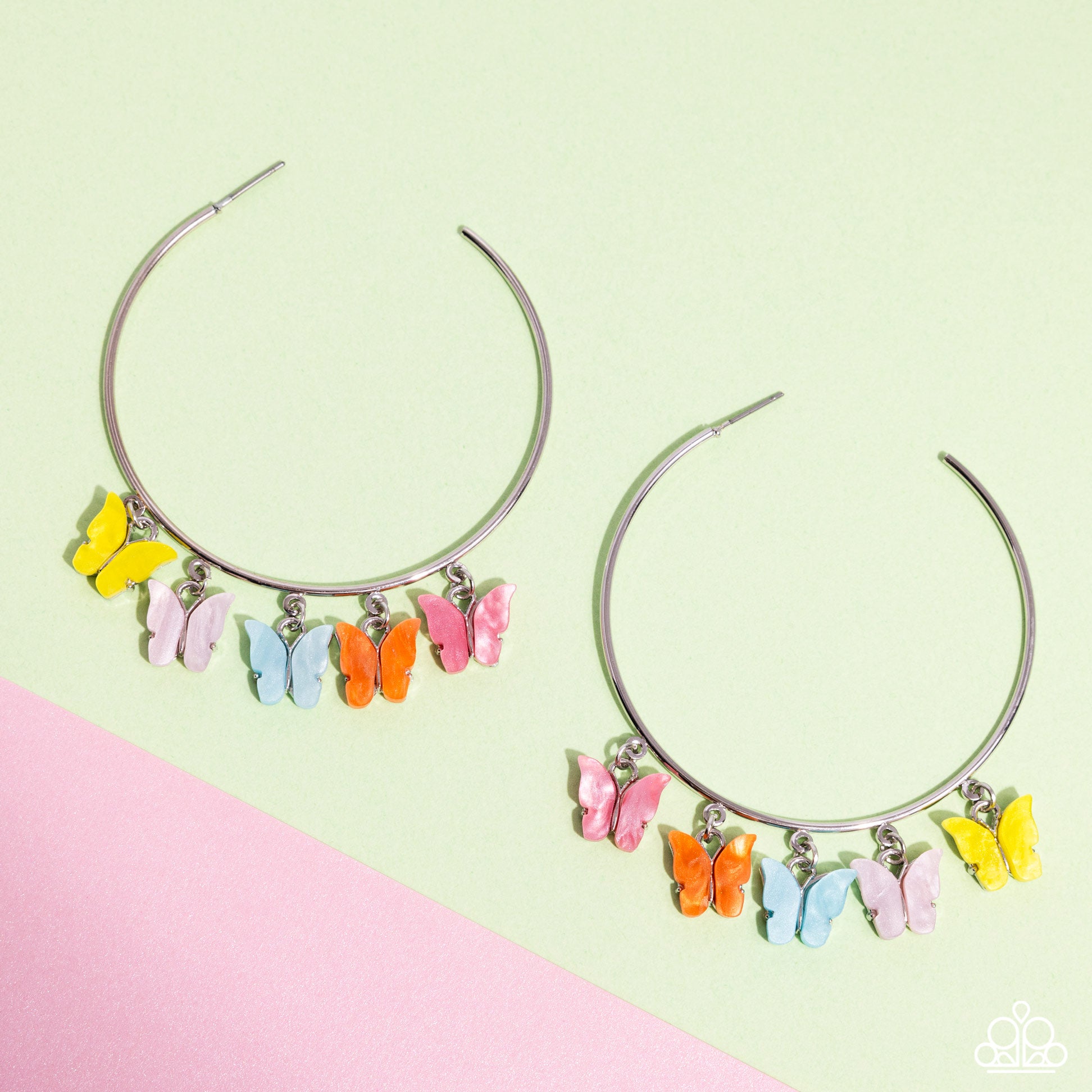 <p data-mce-fragment="1">Attached along an oversized silver hoop, a collection of different colored butterflies flutter and fly along the ear for a whimsical finish. Earring attaches to a standard post fitting. Hoop measures approximately 2 1/4" in diameter. Pattern of colors may vary.</p> <p data-mce-fragment="1"><i data-mce-fragment="1">Sold as one pair of hoop earrings.</i></p>