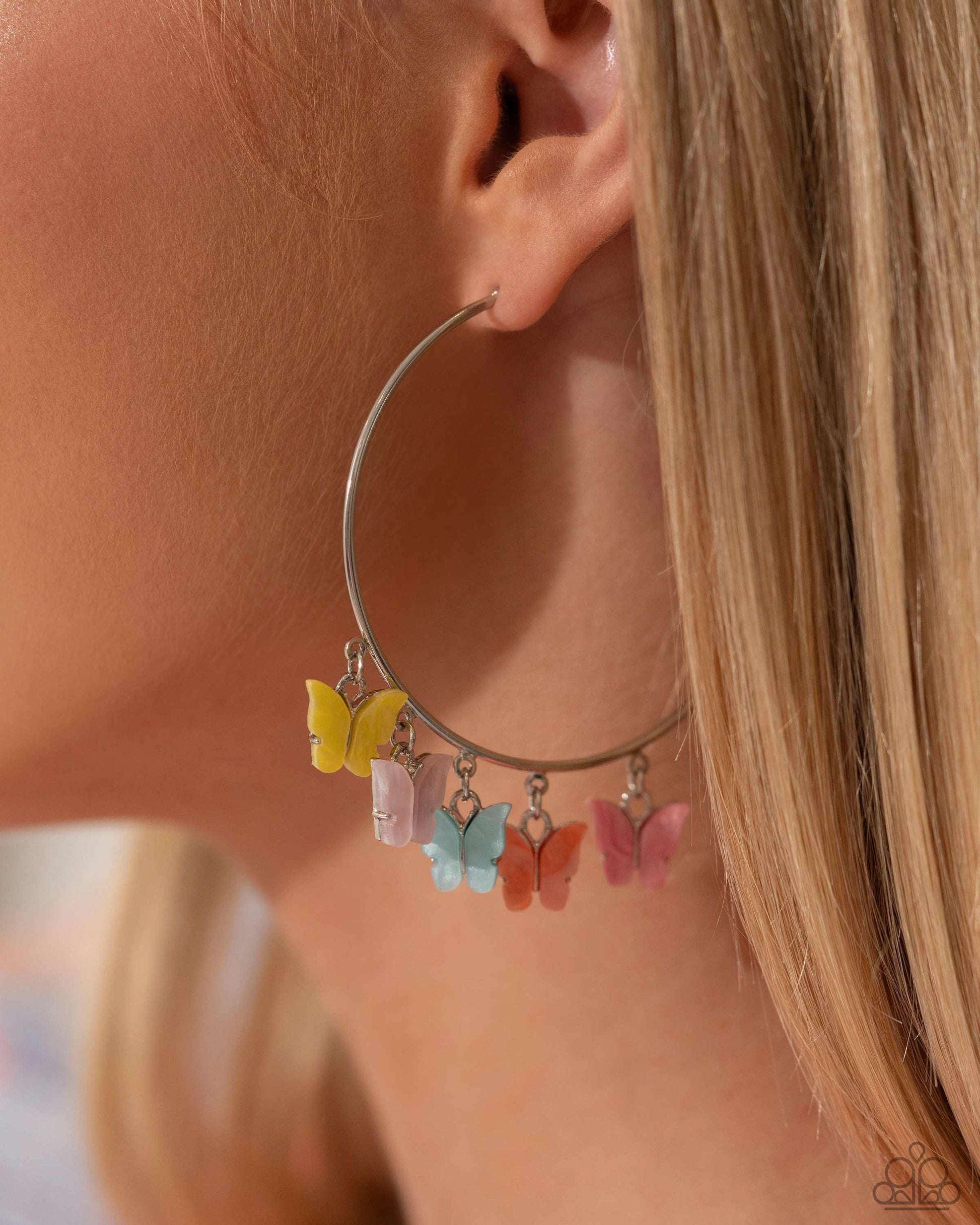 <p data-mce-fragment="1">Attached along an oversized silver hoop, a collection of different colored butterflies flutter and fly along the ear for a whimsical finish. Earring attaches to a standard post fitting. Hoop measures approximately 2 1/4" in diameter. Pattern of colors may vary.</p> <p data-mce-fragment="1"><i data-mce-fragment="1">Sold as one pair of hoop earrings.</i></p>