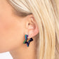 <p>Paparazzi Accessories - In a Galaxy STAR, STAR Away - Multi Hoop Earrings dipped in an oil spill shade, a three-dimensional star-shaped hoop hinges around the ear resulting in a stellar statement. Earring attaches to a standard hinge closure fitting. Hoop measures approximately 1 1/4" in diameter.</p> <p><i>Sold as one pair of hinge hoop earrings.</i></p>