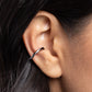 <p>Paparazzi Accessories - Enigmatic Echo - Black Ear Cuffs featuring an abstract pattern, a thin gunmetal bar curls into a warped cuff that wraps around the ear for a simplistic statement. Features a smooth surface for sliding ability to desired position on the ear. Due to its structure, adjusting capability is limited.</p> <p><i>Sold as one pair of cuff earrings.</i></p>