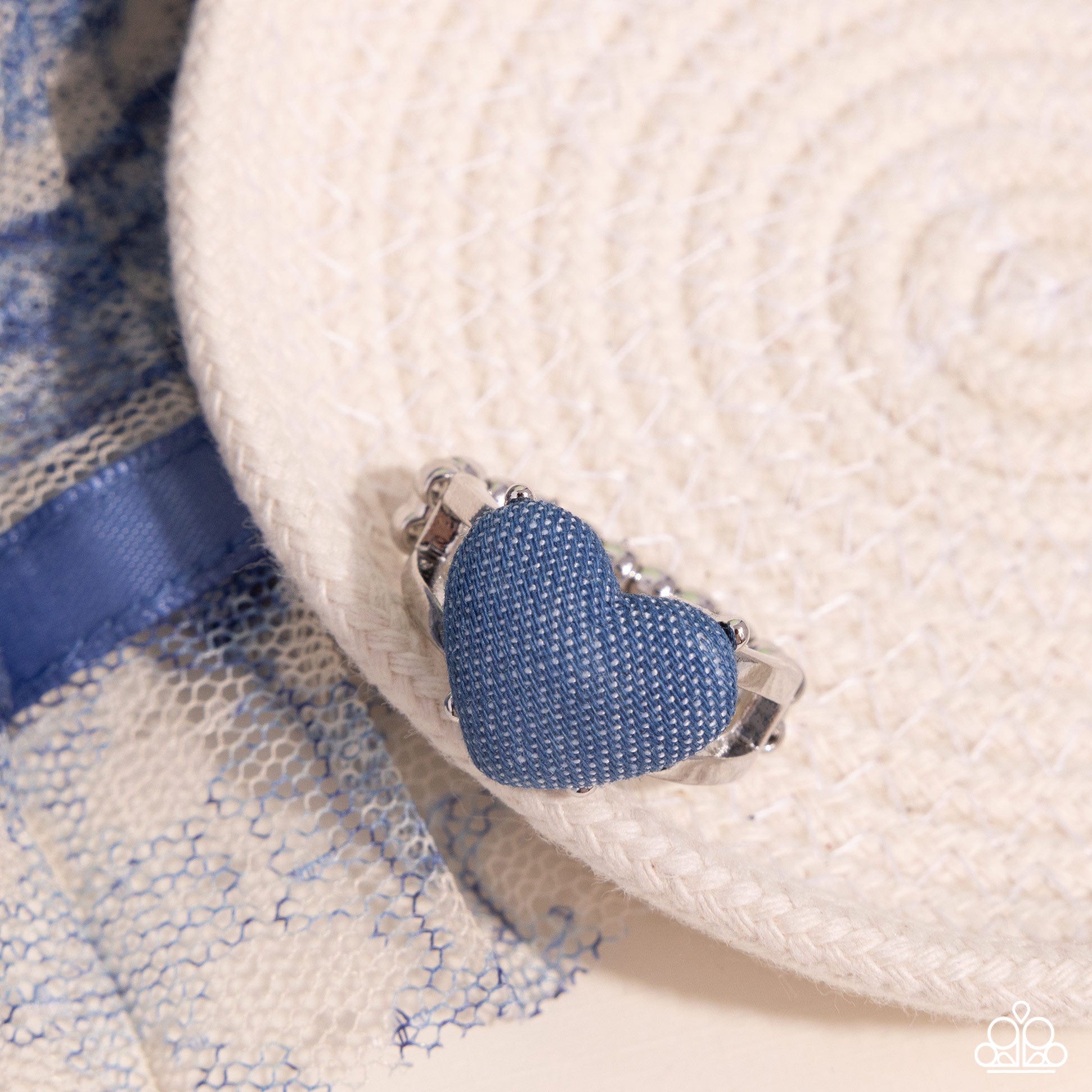 <p data-mce-fragment="1">Paparazzi Accessories - Denim Daydream - Blue Rings featuring a denim-like texture, a light-wash heart is centered amongst airy silver bands atop the finger for a rugged centerpiece. Features a dainty stretchy band for a flexible fit.</p> <p data-mce-fragment="1"><i data-mce-fragment="1">Sold as one individual ring.</i></p>
