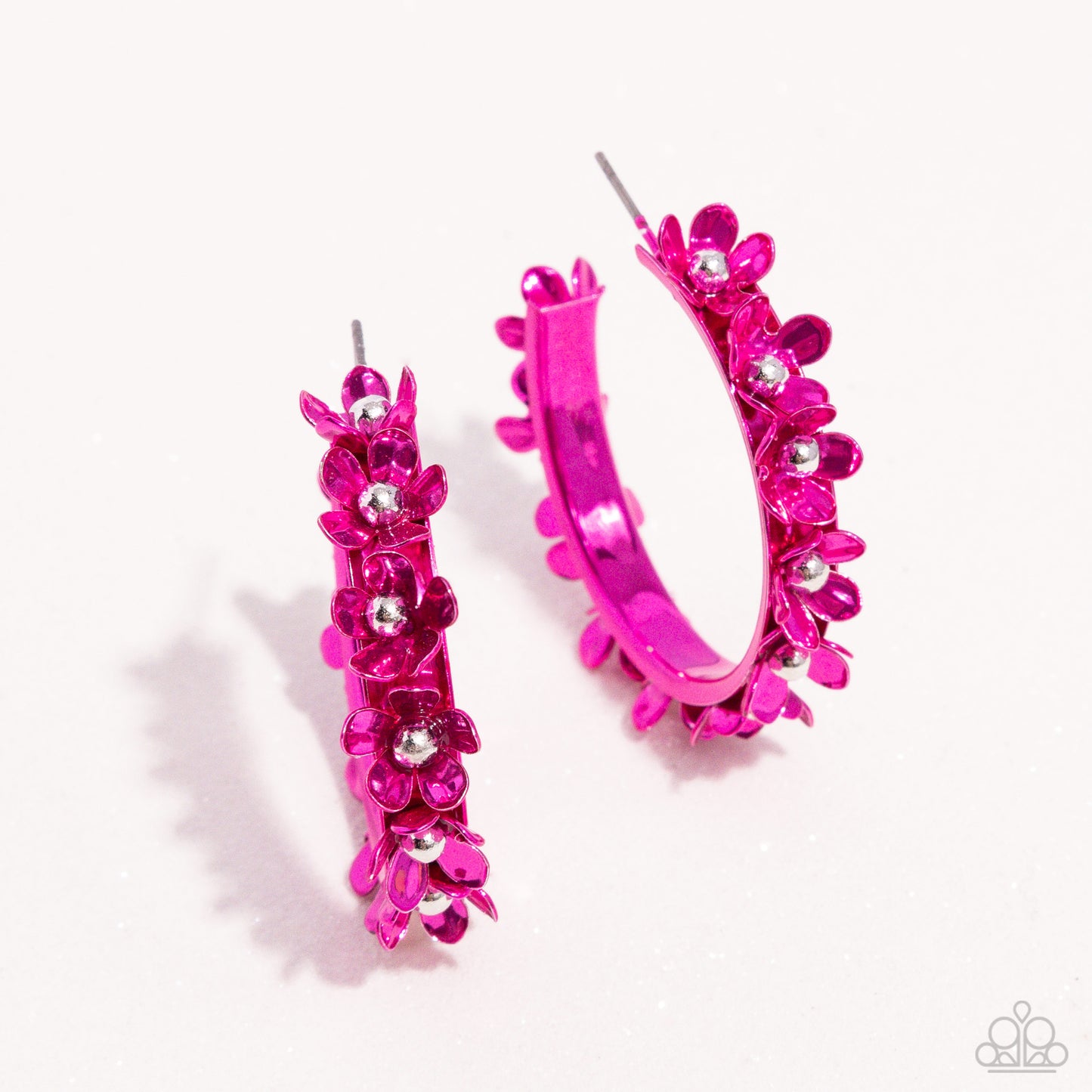 <p>Paparazzi Accessories - Fashionable Flower Crown - Pink Hoop Earrings dipped in a hot pink hue, a hollowed-out hoop curls around the ear. Featuring silver beaded centers, metallic hot pink flowers bloom along the curl of the hollow of the hoop for a fashionable display. Earring attaches to a standard post fitting. Hoop measures approximately 1 1/4" in diameter.</p> <p><i>Sold as one pair of hoop earrings.</i></p>