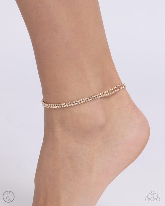 <div class="sku" data-v-510a33b4="">Paparazzi Accessories - Dainty Declaration - Gold Anklets s<span style="font-size: 1rem;">et in gold square fittings, two strands of white rhinestones coalesce around the ankle for a simply shimmering statement. Features an adjustable clasp closure.</span></div> <div class="description" data-v-510a33b4=""> <p><i>Sold as one individual anklet.</i></p> </div>