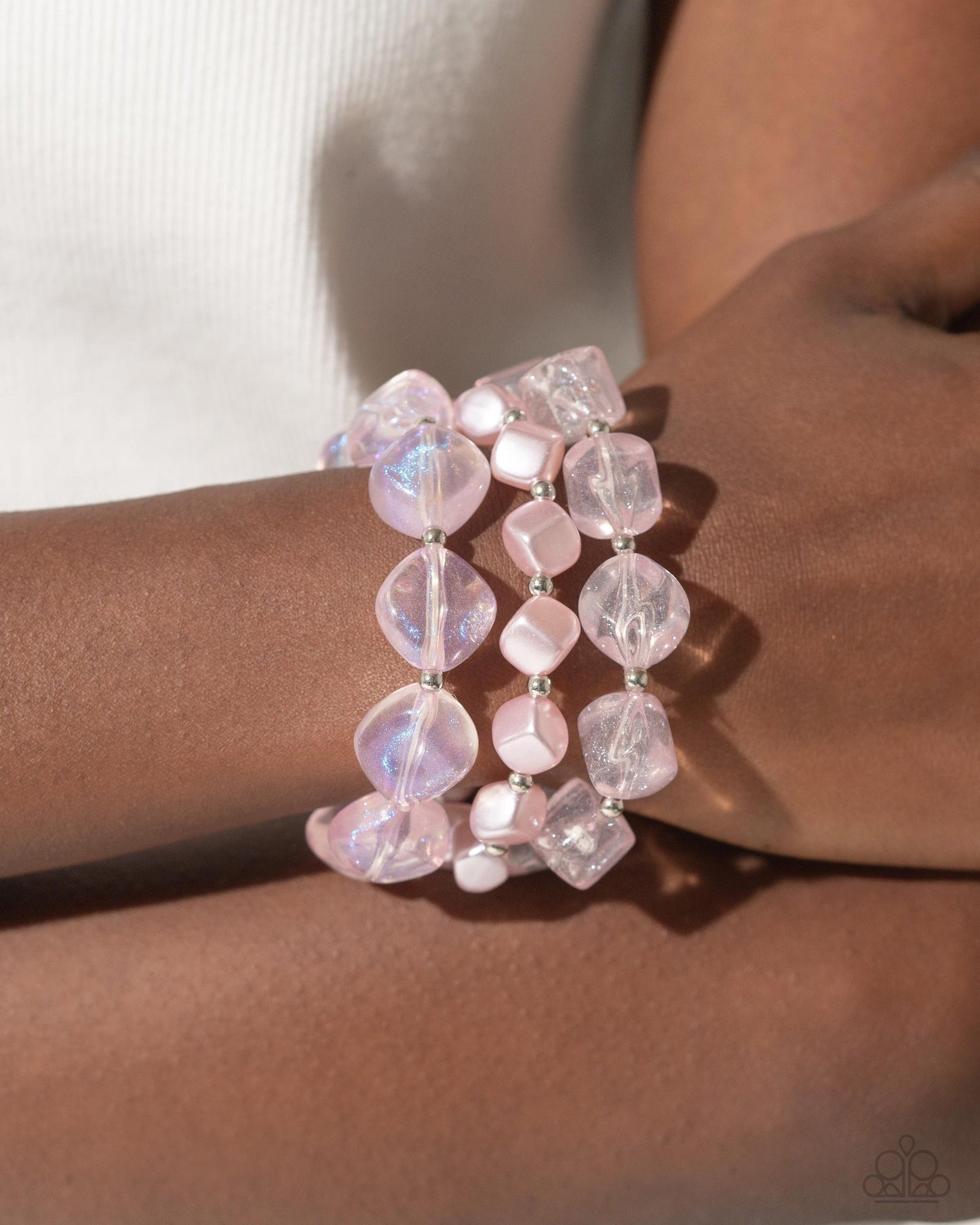 Paparazzi Accessories - Cubed Cameo - Pink Jewelry Sets cubed baby pink pearls join a strand of baby pink clear acrylics that alternate with silver discs and a silver fitting around the neckline. A third strand joins the refined display featuring a silver abstract chain that has dangling silver beads, baby pink pearls in a variety of shapes, and glittery clear acrylics for a classy display. Features an adjustable clasp closure. Sold as one individual necklace. Includes one pair of matching earrings.
