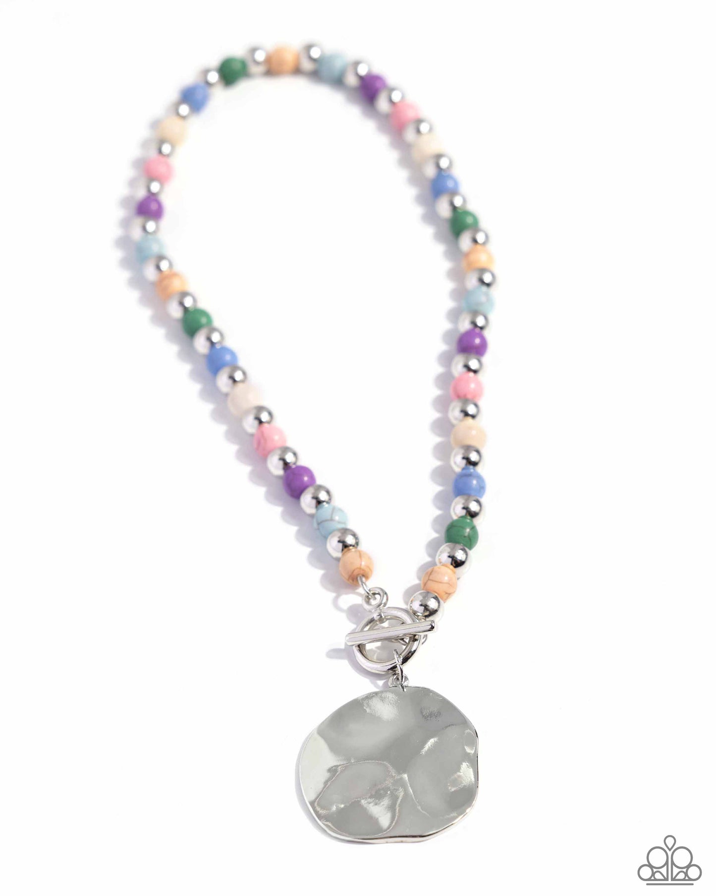 <p data-mce-fragment="1">Infused along an invisible string, colorful stones alternate with high-sheen silver beads as they connect through a toggle closure. A hammered oversized concaved silver disc cascades from the colorful strand for additional eye-catching detail. Features a toggle closure. As the stone elements in this piece are natural, some color variation is normal.</p> <p data-mce-fragment="1"><i data-mce-fragment="1">Sold as one individual necklace. Includes one pair of matching earrings.</i></p>