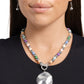 <p data-mce-fragment="1">Infused along an invisible string, colorful stones alternate with high-sheen silver beads as they connect through a toggle closure. A hammered oversized concaved silver disc cascades from the colorful strand for additional eye-catching detail. Features a toggle closure. As the stone elements in this piece are natural, some color variation is normal.</p> <p data-mce-fragment="1"><i data-mce-fragment="1">Sold as one individual necklace. Includes one pair of matching earrings.</i></p>
