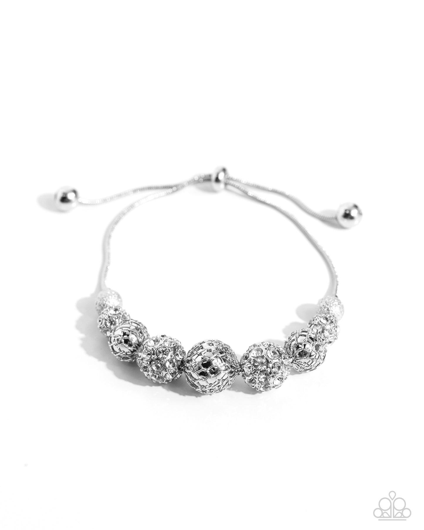 Strung along a glittery silver snake chain, a collection of silver-filigree adorned ornaments, some featuring white gems, glitter, and glow below the neckline. Additional silver-shattered beads frame the whimsical beads for a finishing touch of steampunk-inspired shimmer. Features an adjustable clasp closure. Sold as one individual necklace. Includes one pair of matching earrings.