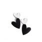 <p data-mce-fragment="1">Paparazzi Accessories - Romantic Occasion - Black Clip-On Earrings dangling from a silver heart frame, another heart frame, this time an oversized one, features black paint, creating an attention-grabbing romantic statement below the ear. Earring attaches to a standard clip-on fitting.</p> <p data-mce-fragment="1"><i data-mce-fragment="1">Sold as one pair of clip-on earrings.</i></p>