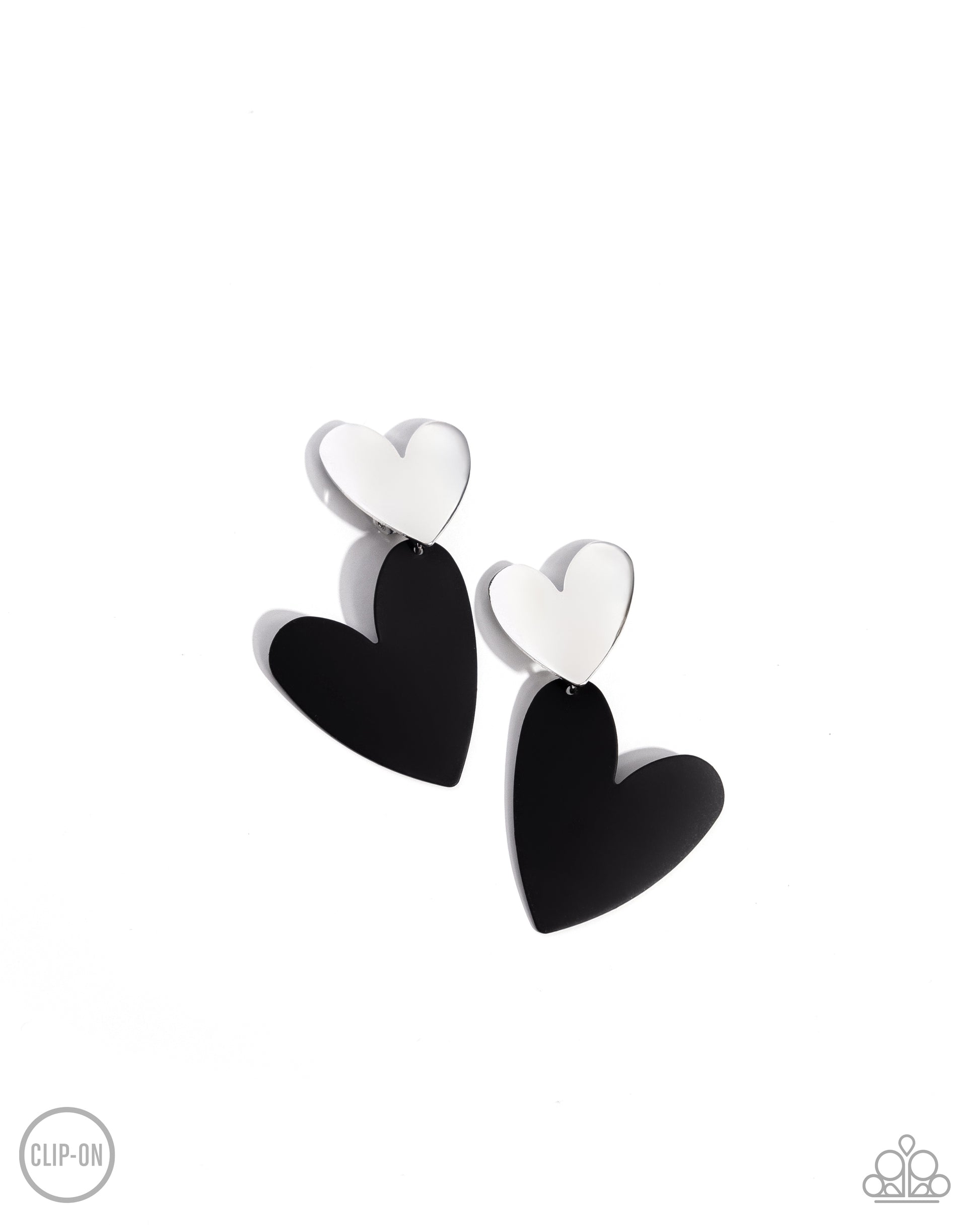 <p data-mce-fragment="1">Paparazzi Accessories - Romantic Occasion - Black Clip-On Earrings dangling from a silver heart frame, another heart frame, this time an oversized one, features black paint, creating an attention-grabbing romantic statement below the ear. Earring attaches to a standard clip-on fitting.</p> <p data-mce-fragment="1"><i data-mce-fragment="1">Sold as one pair of clip-on earrings.</i></p>