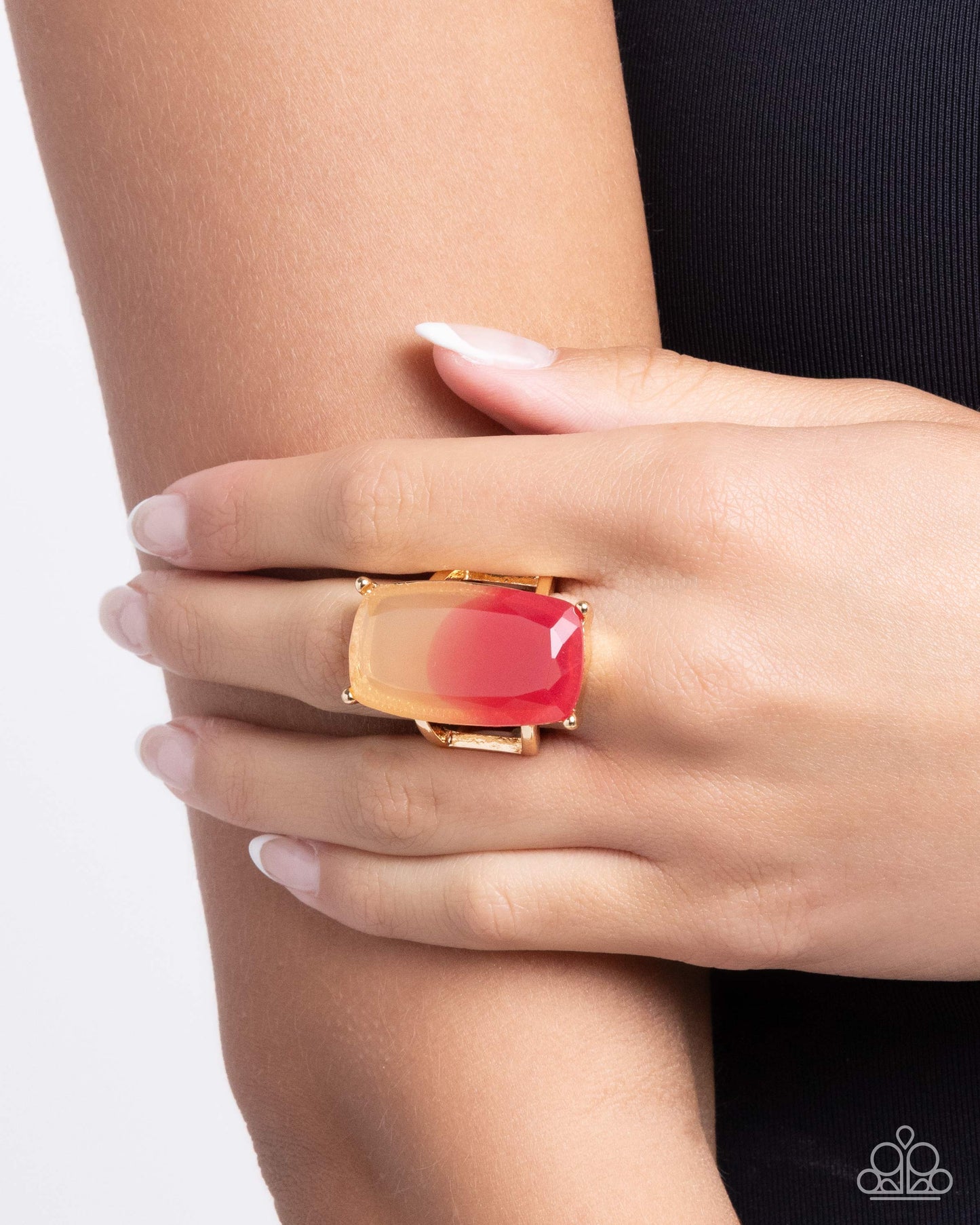elongated faceted gem fades from pink to peach in a gold-pronged fitting for a colorful centerpiece atop the finger. Features a stretchy band for a flexible fit.
Sold as one individual ring.