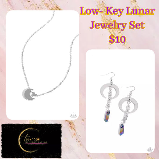 Infused along a dainty silver chain, a silver crescent moon and silver heart charm connect below the collar for a stellar statement. Features an adjustable clasp closure. Sold as one individual necklace. Includes one pair of matching earrings. Delicately cascading from a silver laurel chain, a chiseled oil spill dipped stone swings from the bottom of a shiny silver crescent-shaped hoop, creating a seasonal lure. Earring attaches to a standard fishhook fittings. Sold as one pair of earrings.