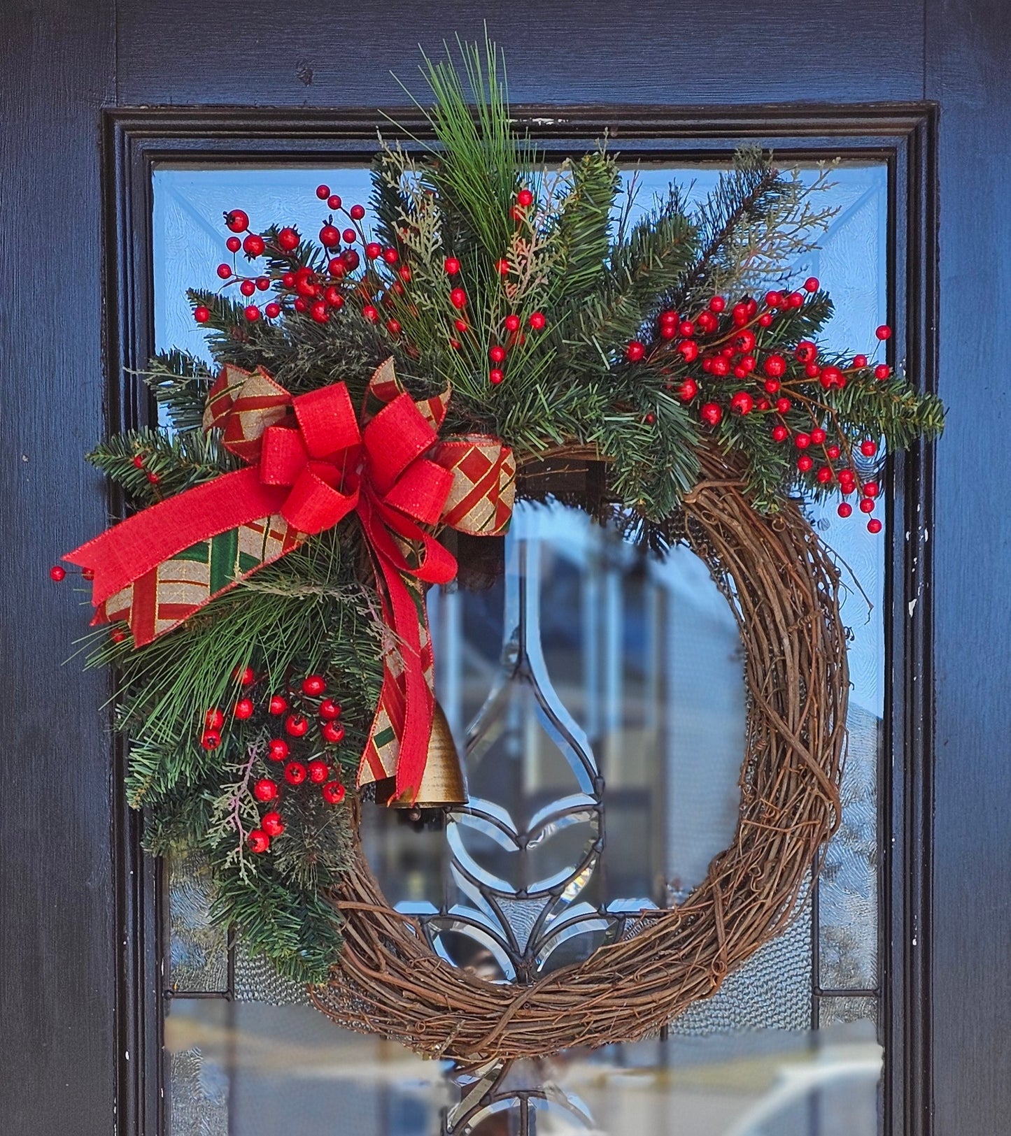 Grapevine greenery wreath with berries and argyle bow