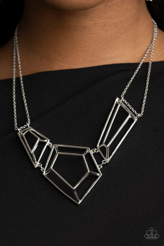 3-D Drama - Silver Necklaces glistening silver bars connect into edgy 3-dimensional frames below the collar, creating a bold geometric statement piece. Features an adjustable clasp closure.  Sold as one individual necklace. Includes one pair of matching earrings.  Paparazzi Jewelry is lead and nickel free so it's perfect for sensitive skin too!