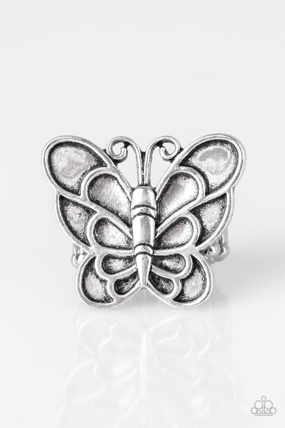 Paparazzi Accessories Sky High Butterfly - Silver Rings brushed in an antiqued finish, a dramatic silver butterfly blooms across the finger for a whimsical look. Features a stretchy band for a flexible fit.  Sold as one individual ring.
