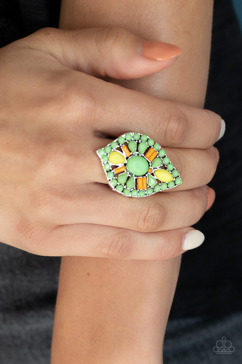 Paparazzi Accessories Jungle Jewelry - Green Rings featuring oval, round, teardrop, and marquise shapes, a vivacious collection of orange, yellow, and green beads are encrusted along the top of a silver frame, creating a colorful tribal centerpiece. Features a stretchy band for a flexible fit. Sold as one individual ring.
