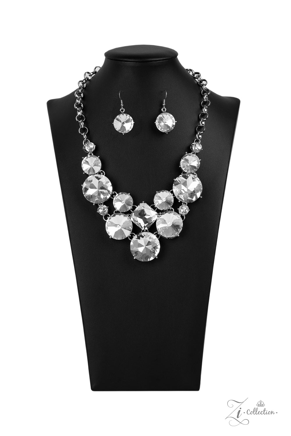 Paparazzi Accessories Unpredictable - 2020 Zi Collection Necklaces varying in size and shape, a dramatic collision of oversized white rhinestones connect into an unapologetically glamorous statement piece below the collar. Attached to chunky silver links, the breathtaking display of clustered gems radiates confidence. Features an adjustable clasp closure.  Sold as one individual necklace. Includes one pair of matching earrings.
