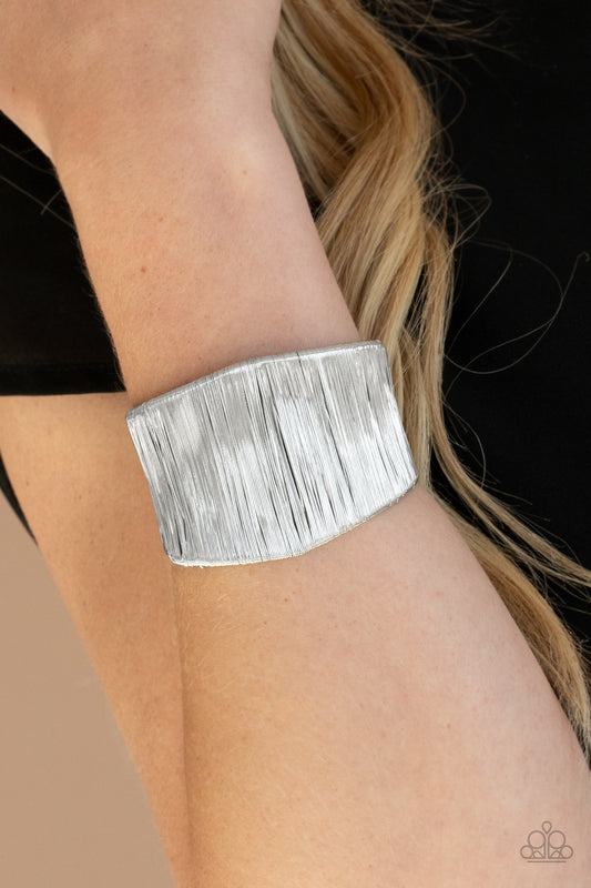 Hot Wired Wonder - Silver Bracelets a seemingly infinite collection of shimmery silver wire wraps around a substantial silver cuff, creating a bold industrial inspired centerpiece around the wrist.  Sold as one individual bracelet.
